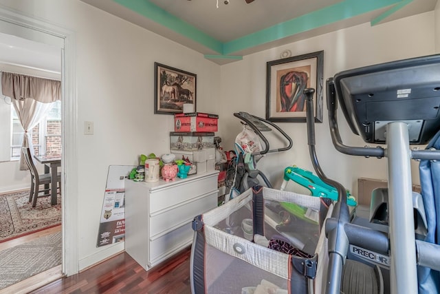 interior space with ceiling fan and dark wood-type flooring