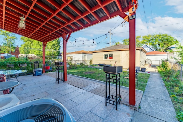 view of patio featuring an outdoor structure