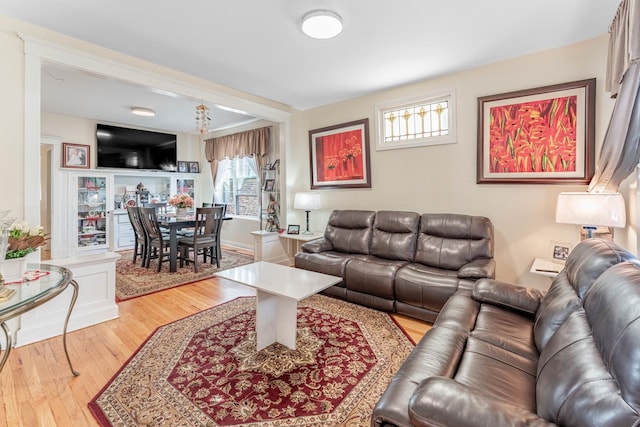 living room featuring light hardwood / wood-style flooring and a wealth of natural light