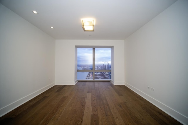 empty room featuring dark hardwood / wood-style floors