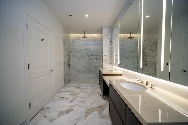 bathroom featuring tiled shower and vanity