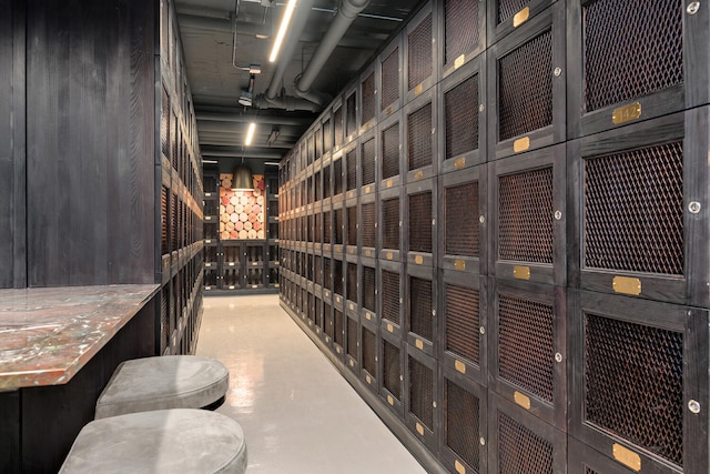 wine room featuring concrete flooring