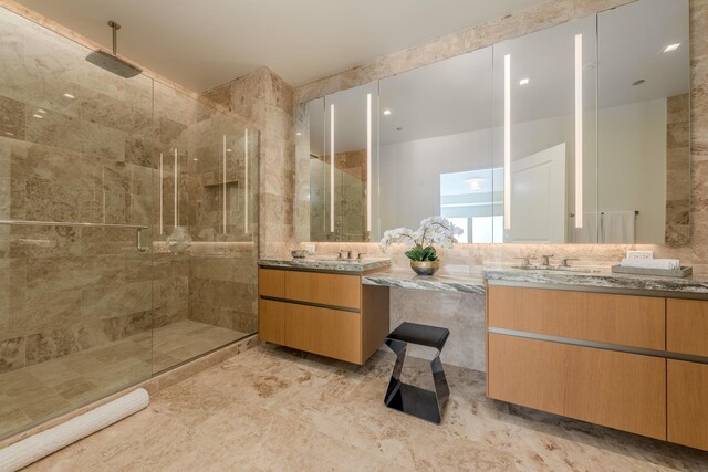 full bathroom featuring vanity and a stall shower