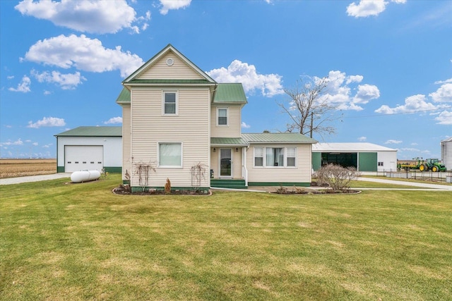 view of front of house with a garage and a front yard