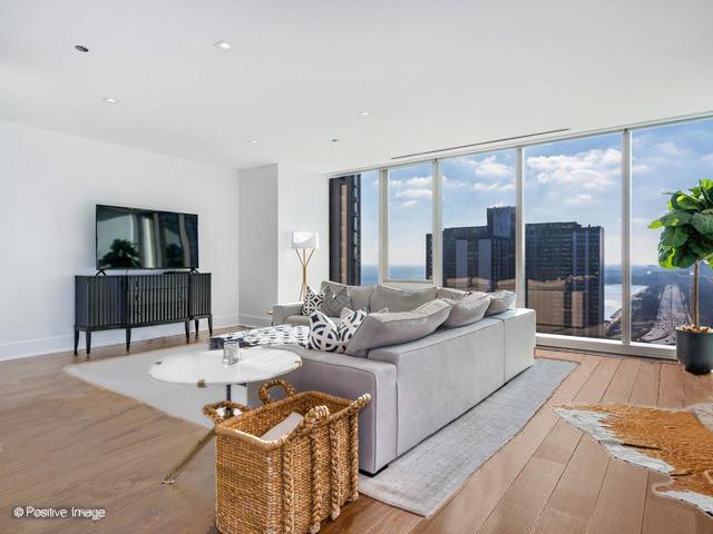 living room with light hardwood / wood-style flooring and a wealth of natural light