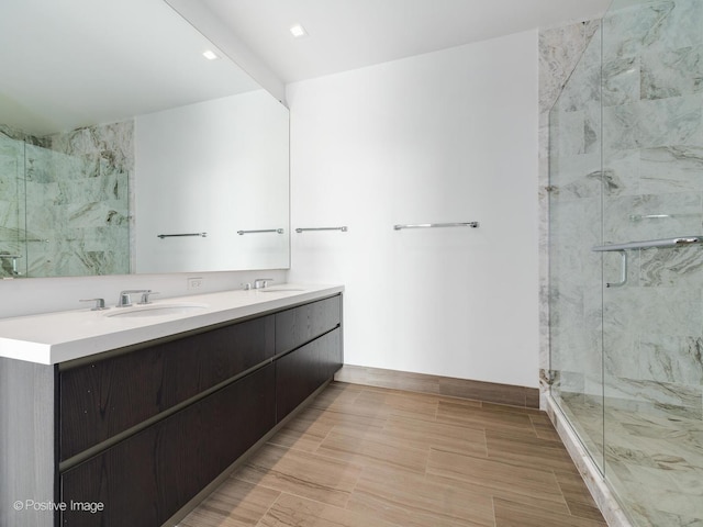 bathroom with vanity and an enclosed shower