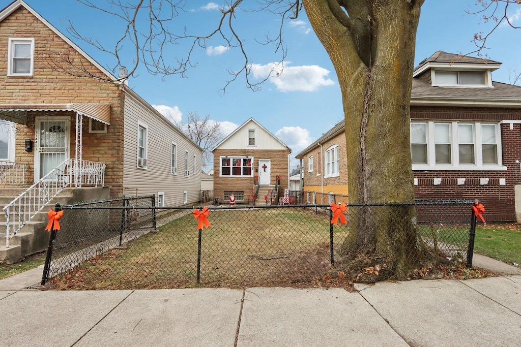 view of side of property with a lawn