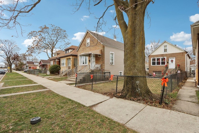 bungalow-style house featuring a front yard