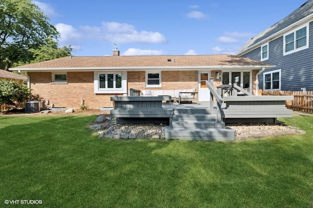 back of house with a lawn, an outdoor hangout area, central AC unit, and a wooden deck