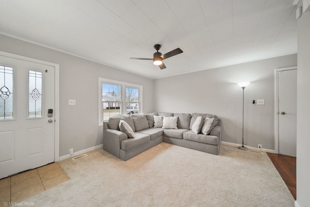 living room featuring ceiling fan and carpet floors