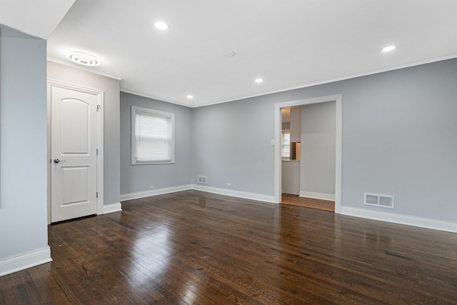 unfurnished room with dark wood-type flooring and ornamental molding