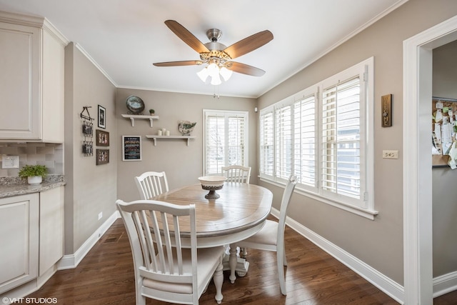 dining area featuring dark hardwood / wood-style flooring, ceiling fan, and crown molding