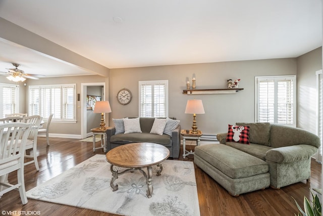 living room with hardwood / wood-style floors, a wealth of natural light, and ceiling fan