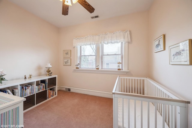 bedroom featuring ceiling fan and light carpet