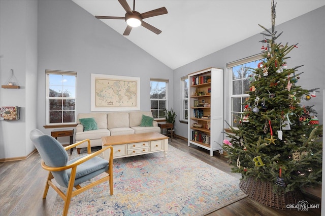 living room featuring hardwood / wood-style floors, high vaulted ceiling, and ceiling fan