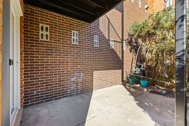 view of side of property with a patio area