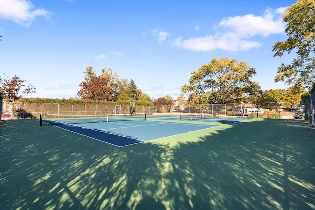 view of tennis court featuring basketball court