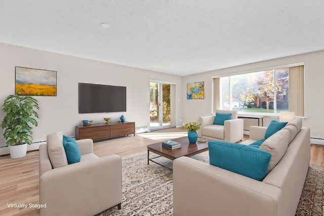 living room featuring light wood-type flooring and a baseboard radiator