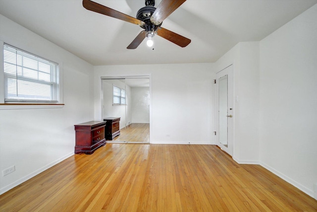 interior space with ceiling fan and light hardwood / wood-style flooring