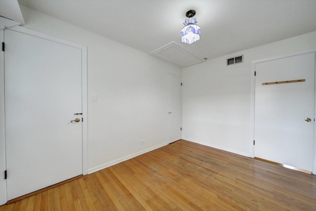 empty room featuring wood-type flooring