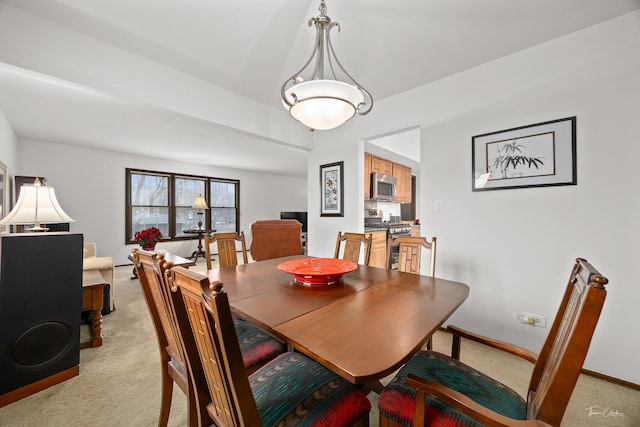 view of carpeted dining area