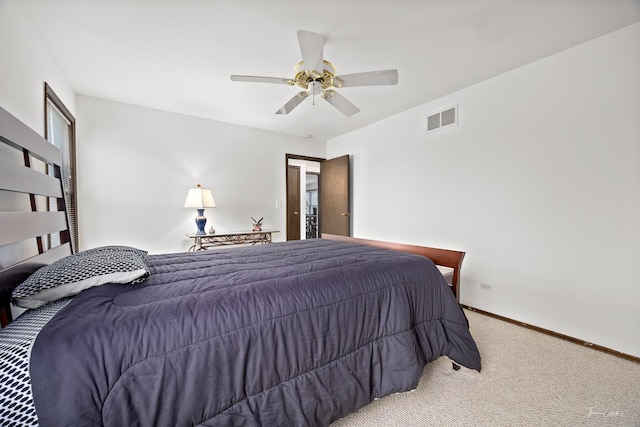 bedroom with ceiling fan and carpet