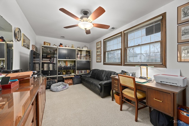 office featuring light carpet and ceiling fan