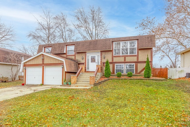 view of front facade with a front yard and a garage