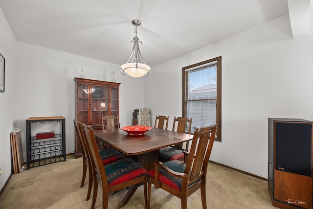 dining room with light colored carpet