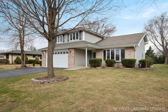 view of property with a garage and a front yard