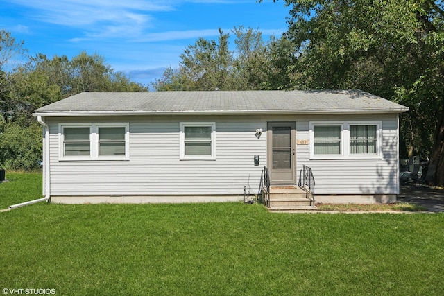 view of front of home with a front yard