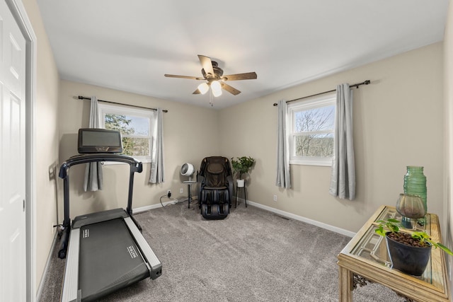 workout room with carpet flooring, plenty of natural light, and ceiling fan