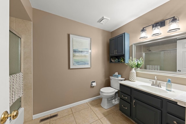 bathroom with tile patterned floors, vanity, and toilet