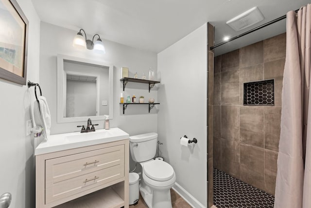 bathroom with vanity, toilet, and walk in shower