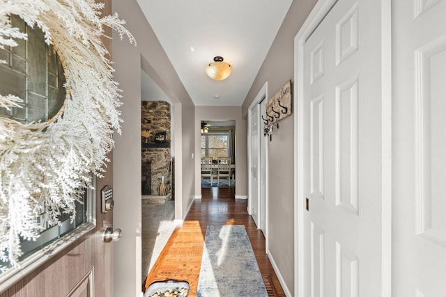 corridor with dark hardwood / wood-style floors