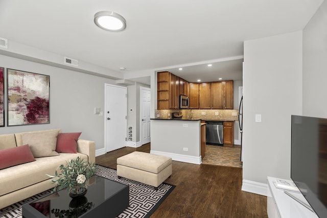 living room with dark hardwood / wood-style flooring