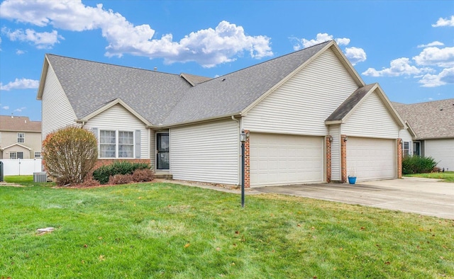 view of front of house featuring a garage and a front yard