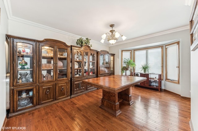 office space featuring crown molding, dark wood finished floors, and a notable chandelier