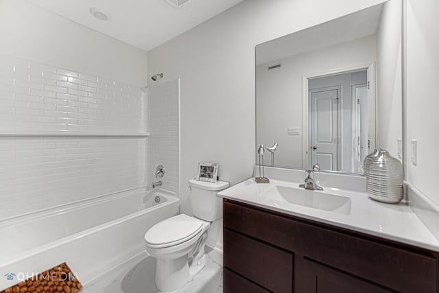 full bathroom with vanity, toilet, and tiled shower / bath