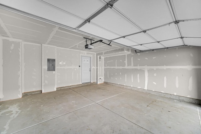 garage featuring electric panel and a garage door opener