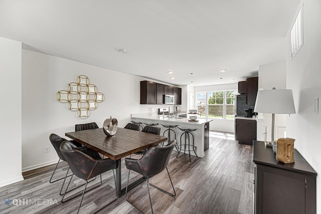 dining space featuring hardwood / wood-style flooring