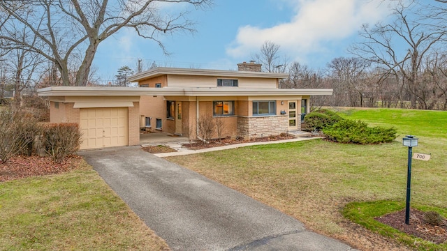 view of front facade with a front yard and a carport