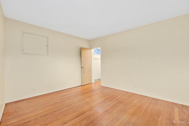 unfurnished room with light hardwood / wood-style flooring