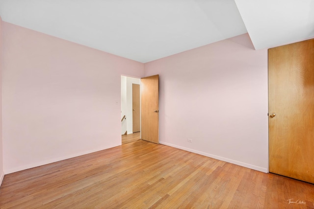 spare room featuring light wood-type flooring