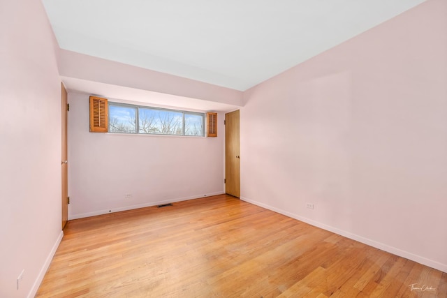 unfurnished room featuring light hardwood / wood-style flooring