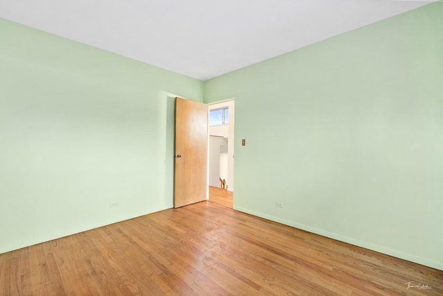 empty room with light hardwood / wood-style floors