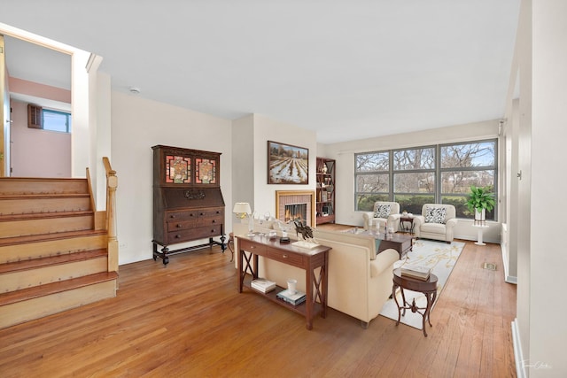 living room with light hardwood / wood-style flooring