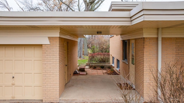 view of side of home with a carport