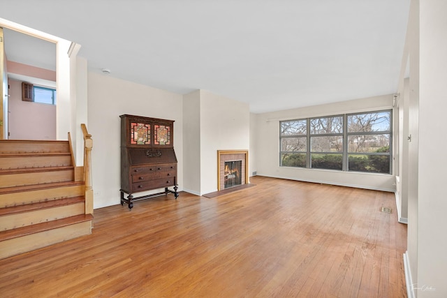 unfurnished living room featuring light hardwood / wood-style flooring