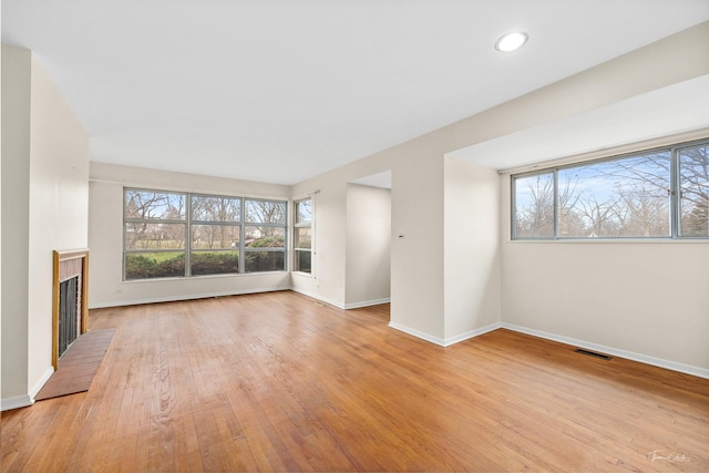 unfurnished living room featuring light hardwood / wood-style flooring